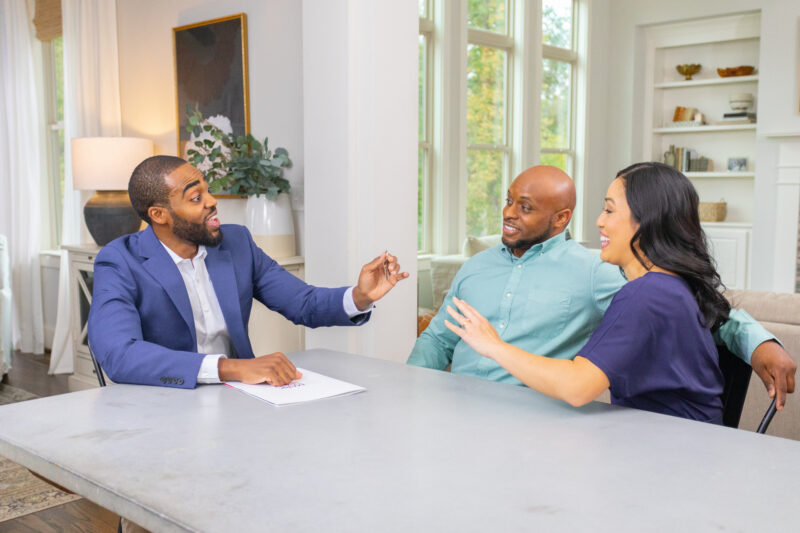 Buyers being handed keys after their closing